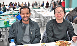 Two students at the 2018 Thanksgiving Unity Dinner