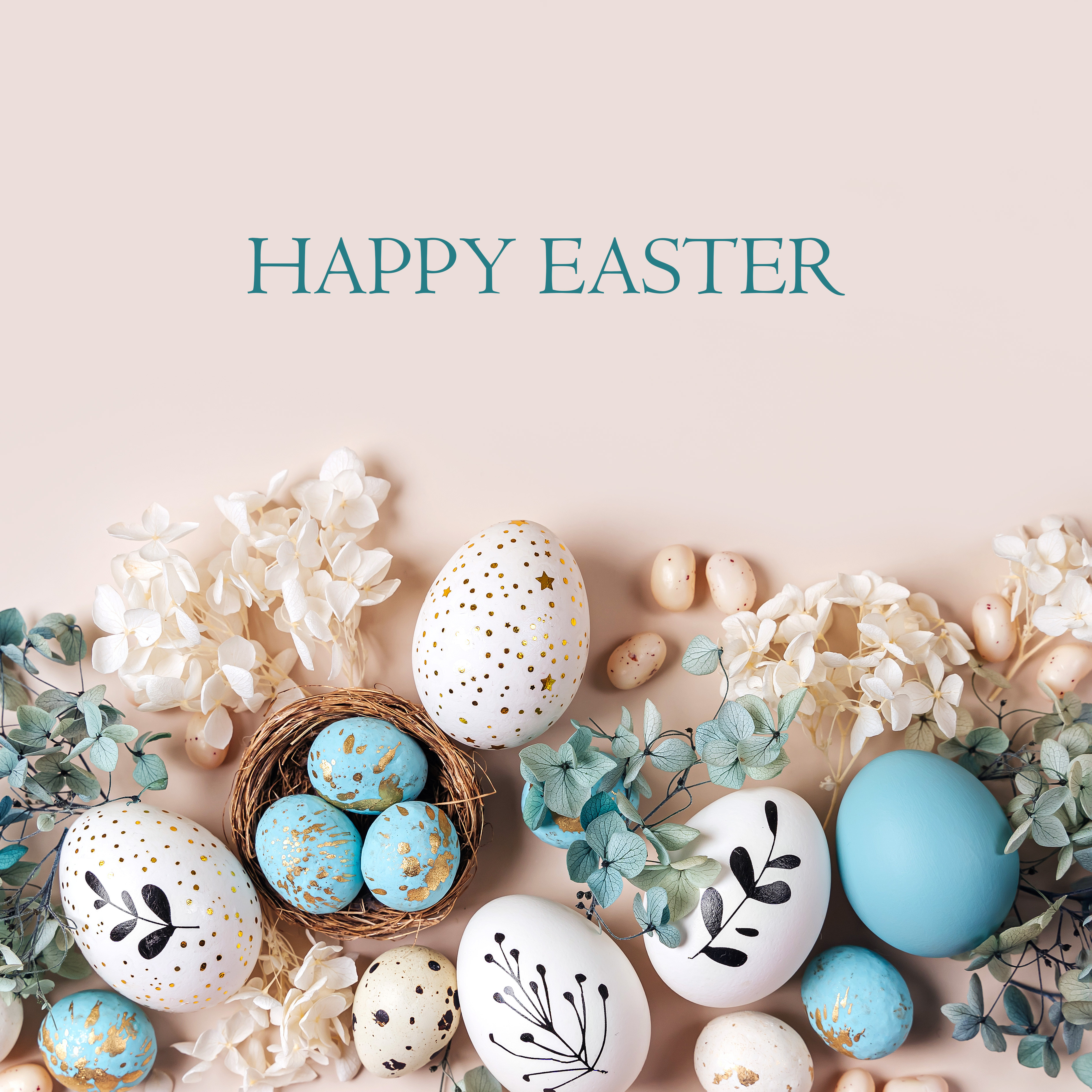 Happy Easter with a display of colorful eggs and nest and flowers